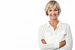 Smiling Middle Aged Lady, Arms Crossed Stock Photo