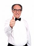 Smiling Old Man Gesturing Thumbs Up Stock Photo