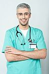 Smiling Physician, Arms Crossed Stock Photo