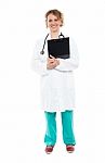 Smiling Physician With Clipboard And Stethoscope Stock Photo