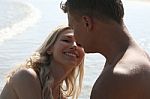 Smiling romantic Couple At Beach Stock Photo