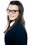 Smiling schoolgirl wearing glasses Stock Photo