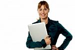 Smiling Secretary Holding Laptop Stock Photo