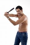 Smiling Strong Man With Wooden Stick Stock Photo