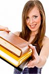 Smiling Student Showing Books Stock Photo