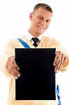 Smiling Student Showing notebook Stock Photo