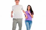 Smiling Teenage Couple Running Stock Photo