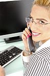 Smiling Woman Busy On Phone Stock Photo