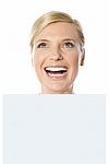 Smiling Woman Holding Whiteboard Stock Photo