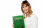 Smiling Woman Showing Big Calculator Stock Photo