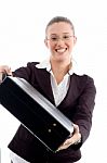 Smiling Woman Showing Briefcase Stock Photo