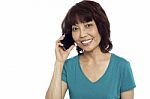 Smiling Woman Talking Over Phone Stock Photo