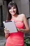 Smiling Woman Using Digital Tablet Stock Photo