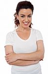 Smiling Woman With Arms Crossed Stock Photo