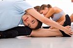 Smiling Young Asian Woman Doing Yoga Stock Photo