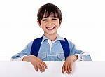 Smiling Young Boy Behind The Blank Board Stock Photo