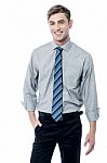 Smiling Young Businessman Standing Stock Photo