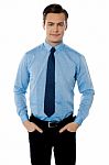 Smiling Young Businessman Standing Stock Photo