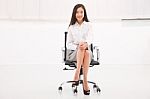 Smiling Young Businesswoman Sitting Chair Stock Photo