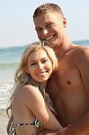 Smiling Young Couple At Beach Stock Photo