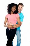 Smiling Young Couple Embracing Stock Photo