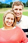 Smiling Young Couple In Outdoor Stock Photo