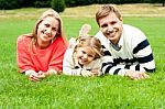 Smiling Young Family In Outdoors Stock Photo