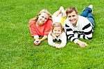 Smiling Young Family In Outdoors Stock Photo