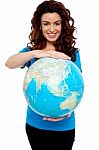 Smiling Young Girl Holding Globe Stock Photo