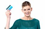 Smiling Young Girl Showing Her Cash Card Stock Photo