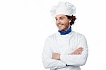 Smiling Young Male Chef Posing Confidently Stock Photo