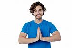 Smiling Young Man In Welcome Gesture Stock Photo