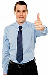 Smiling Young Man With Thumbs Up Gesture Stock Photo