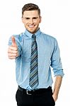 Smiling Young Man With Thumbs Up Gesture Stock Photo