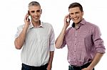 Smiling Young Men With Cell Phones Stock Photo