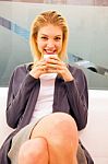 Smiling Young Woman Holding Cup Stock Photo