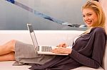 Smiling Young Woman Using Laptop Sitting Couch Stock Photo