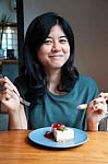 Smiling Young Woman With A Cake Stock Photo