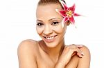 Smiling Young Woman With A Lily Flower Stock Photo