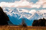 Snow Caped Mountain Scape With A Flat Plain Stock Photo