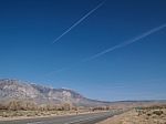 Snow Capped Mountains, Blue Sky, Desert Landscape Stock Photo