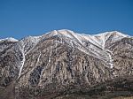 Snow Capped Mountains, Blue Sky, Desert Landscape Stock Photo