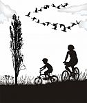 Son And Mother On Bikes Stock Photo