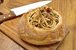 spaghetti In Bread with knife Stock Photo