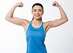 Sporty Woman Showing Her Biceps Stock Photo