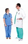 Standing Senior Surgeons On White Stock Photo