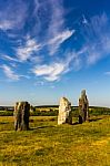 Standing Stones In A Green Field Stock Photo