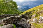 Stone Bridge Over A Stream In The Lake District Stock Photo