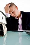 stressed Businessman at his desk Stock Photo