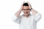 Stressed Man Having Strong Headache Stock Photo